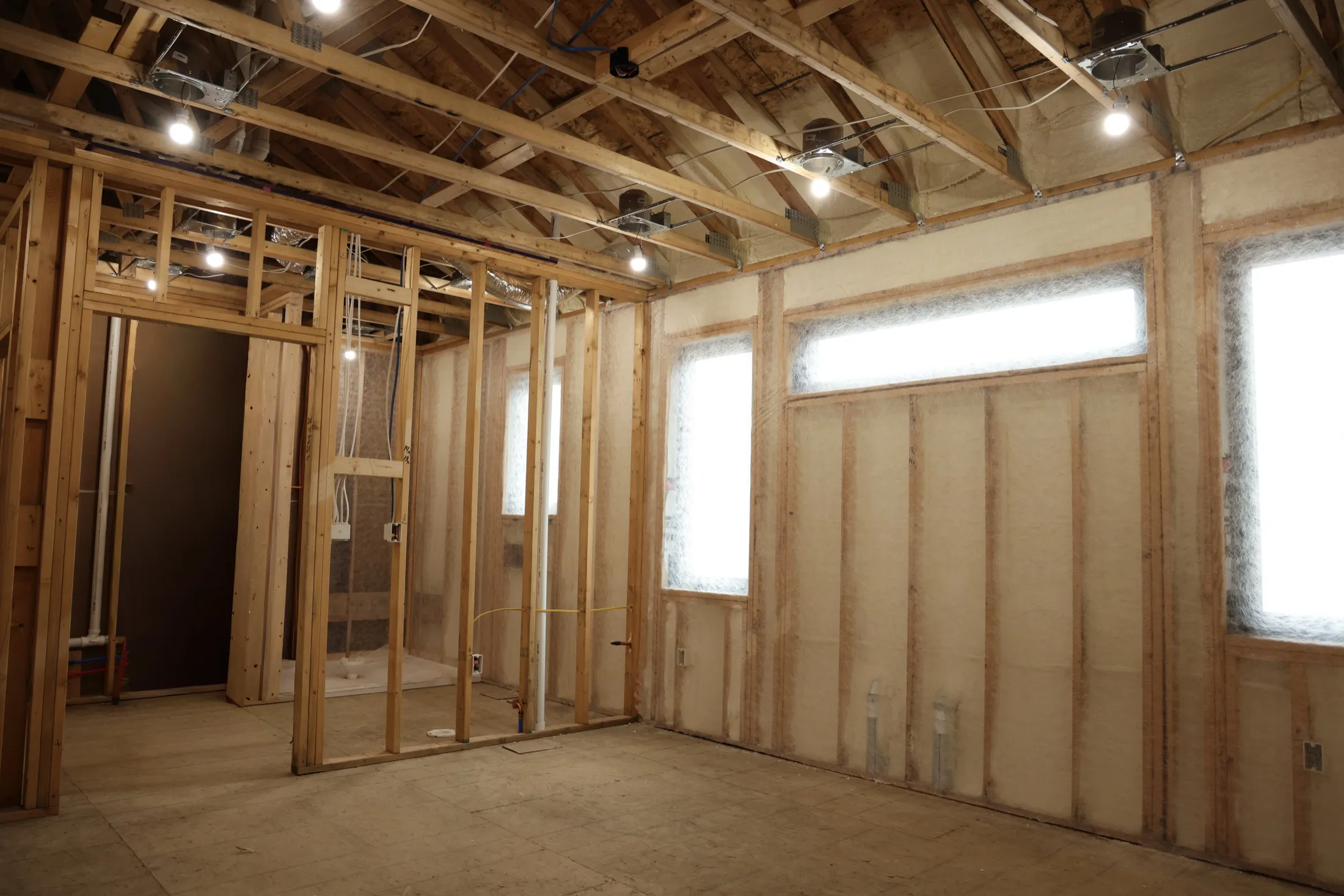 Spray foam applied to a wall assembly